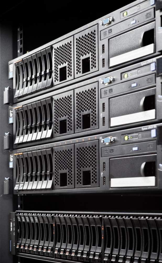 Large 3U servers lined vertically on a server rack